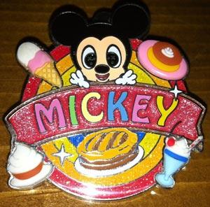 Mickey Mouse surrounded by sweets/pastries