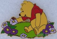 DLR - Pooh sitting in flower garden