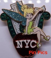 Tinker Bell sitting on an apple with NYC inside