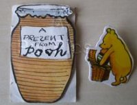Classic Pooh getting a Jar of Honey out of his Basket